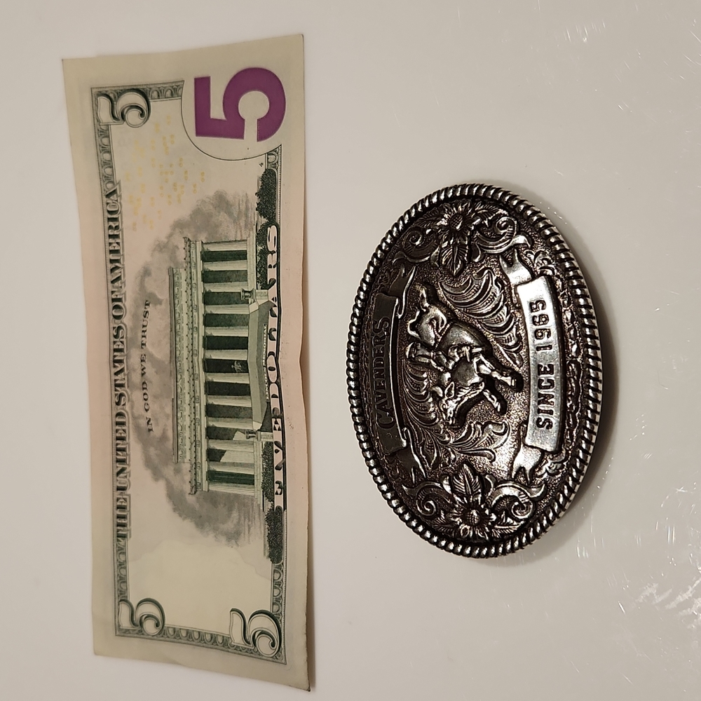 Cavender's silver belt buckle